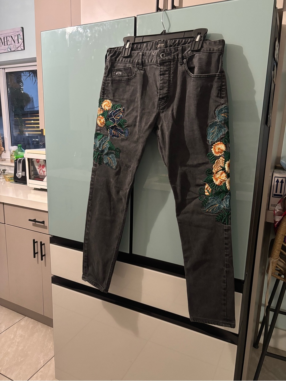Embroidered Black Jeans with Floral Accent